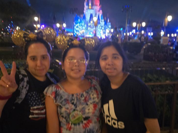 Guest Photo from Javier: Guests in front of Cinderella Castle at Magic Kingdom at night