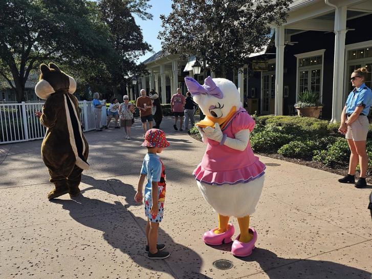 Guest Photo from Amy: Guest with characters at Walt Disney World 
