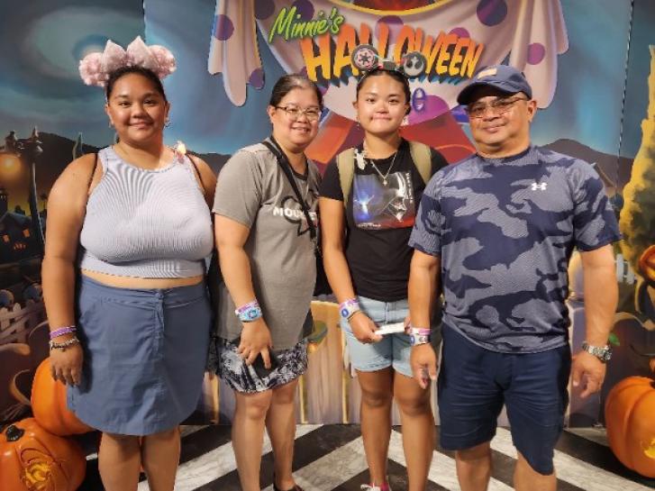 Guest Photo from Christina:  Guests in front of Minnie's Halloween Dine display