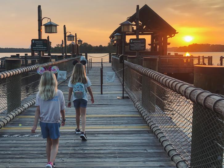 Guest Photo from Whitney Deal: Guests at Disney World boat dock at sunset
