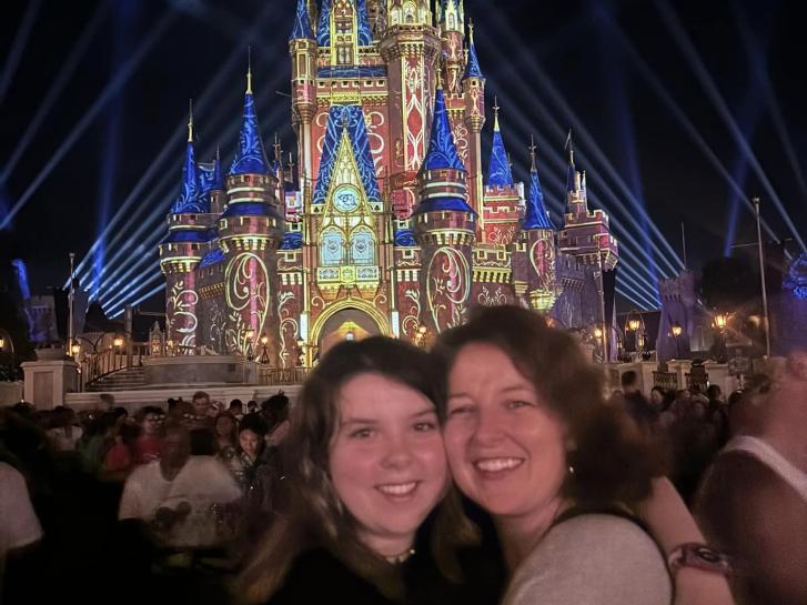 Guest Photo from Sarah: Guests at Cinderella Castle at Magic Kingdom at night